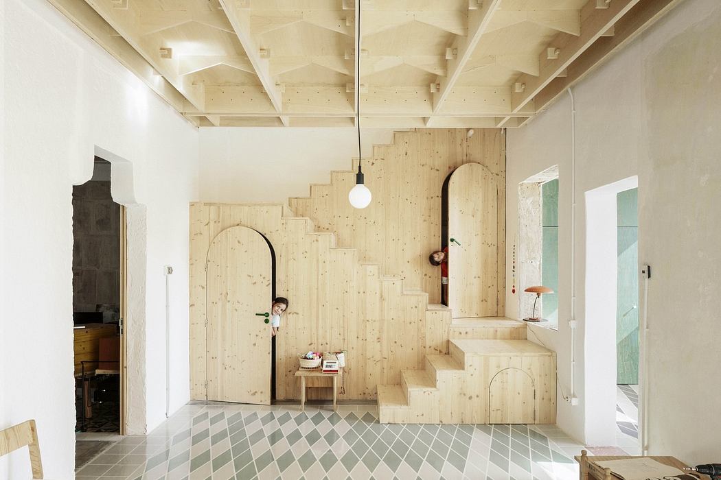 Minimalist room with plywood staircase and patterned tile floor.