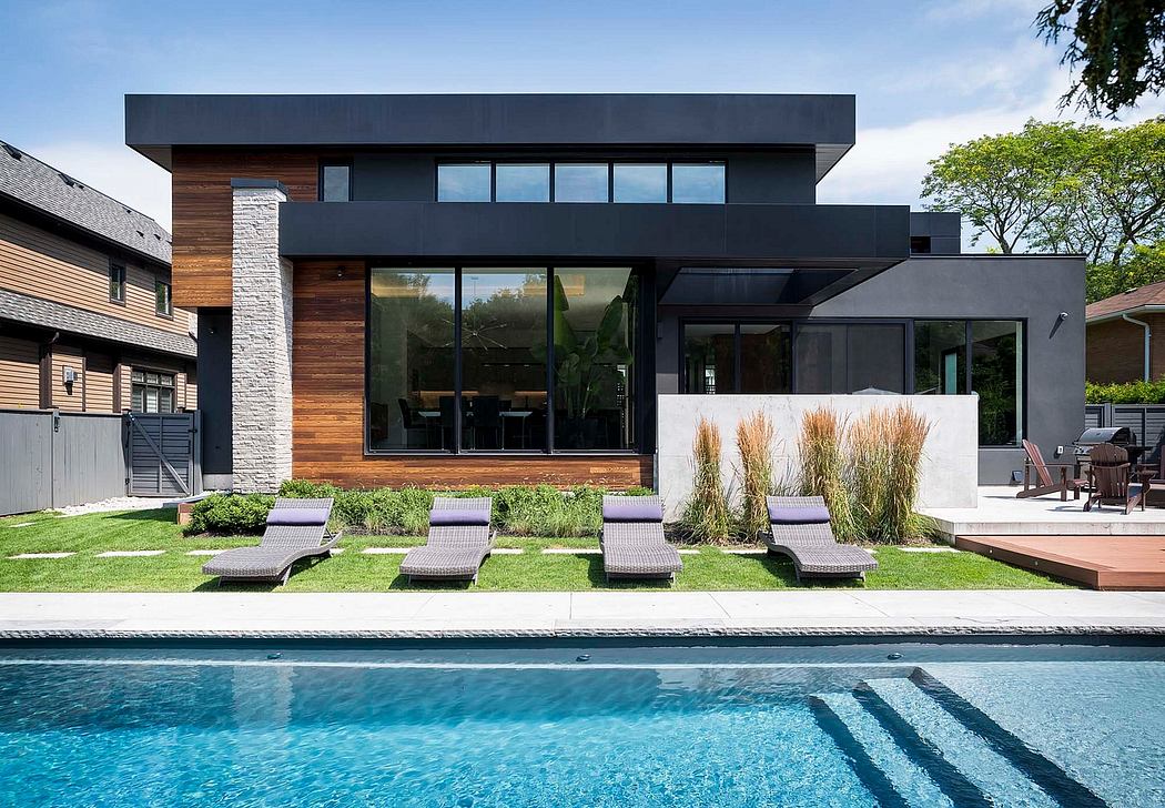 Contemporary house with pool and wooden accents.
