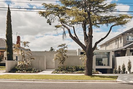 Contemporary home with large windows and flat, minimalistic facade.