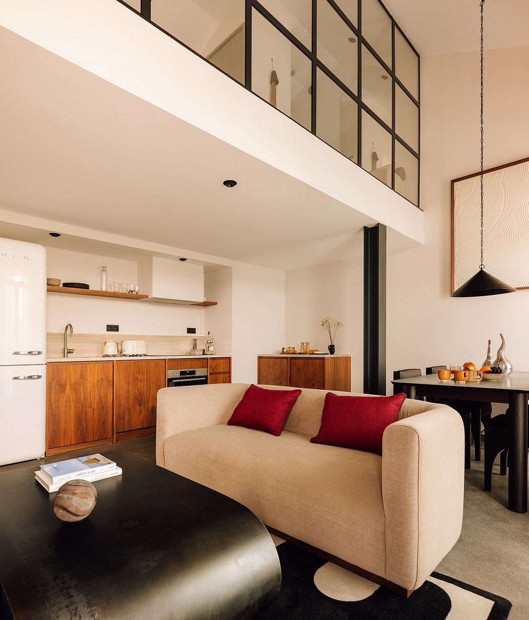 Loft-style interior with mezzanine and minimalist decor.