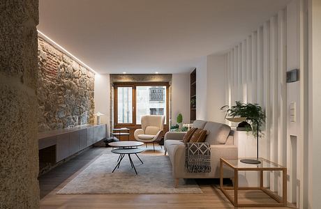 Contemporary living room with exposed stone wall and sleek furnishings.