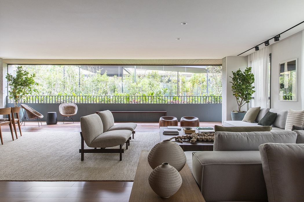 Modern living room with neutral tones and floor-to-ceiling windows.