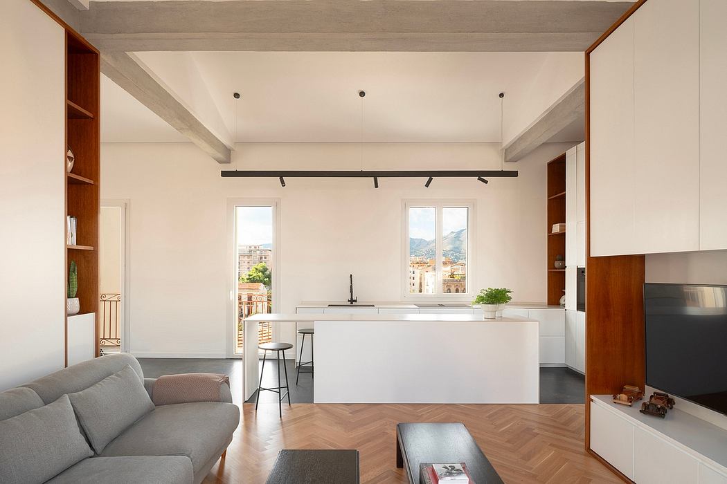 Contemporary living space with minimalist design and exposed ceiling beams.