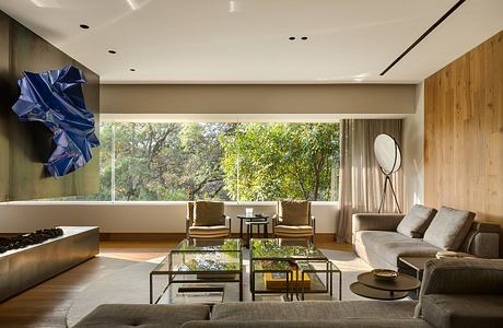 Contemporary living room with wooden walls and large window.