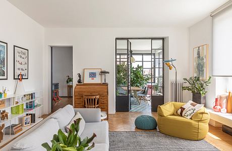 Bright living room with modern furniture and a balcony access.