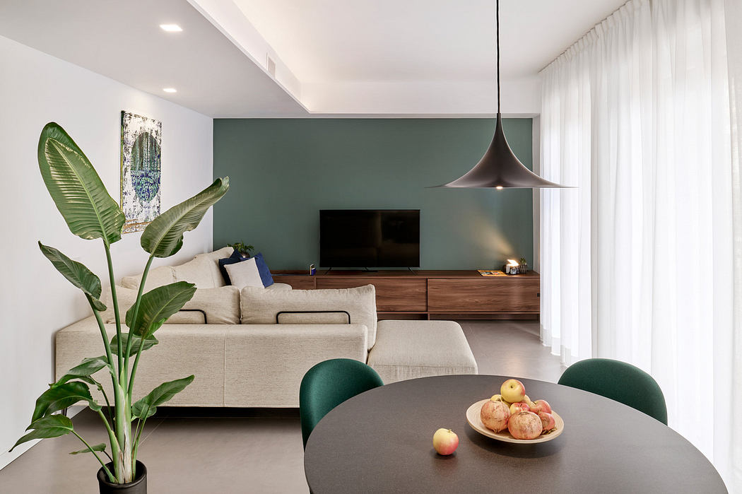 Contemporary living room with teal accent wall and sleek furnishings