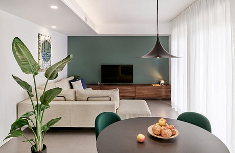 Contemporary living room with teal accent wall and sleek furnishings