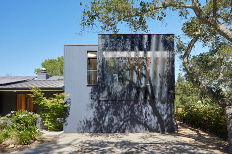 Contemporary house with unique metal screen façade.