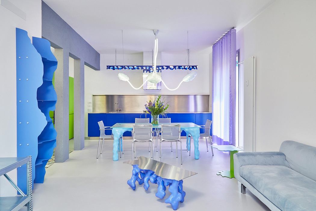 Vibrant, modern kitchen and dining area with striking blue and green accents.