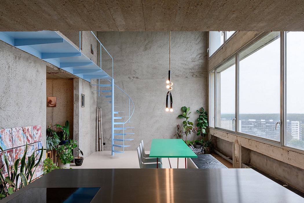 Modern interior with concrete walls, a spiral staircase, and minimalist furniture.