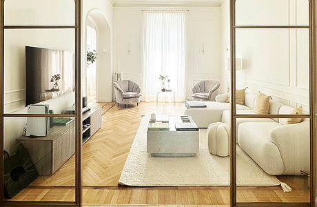 Elegant living room viewed through arched glass doors with patterned floor border.