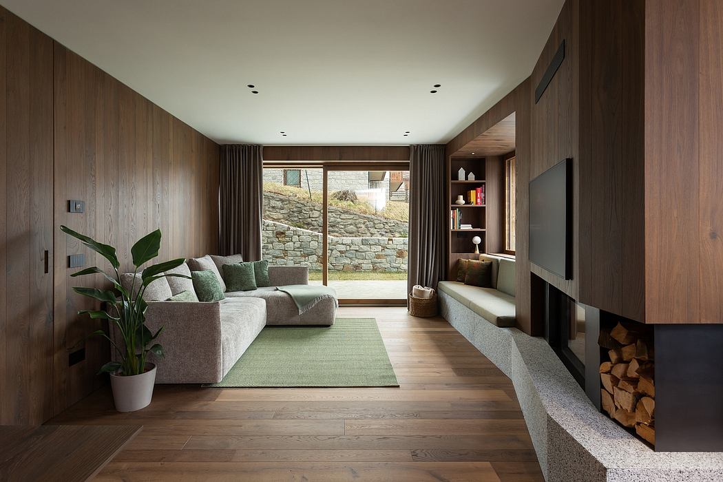 Contemporary living room with wooden paneling and a large window.