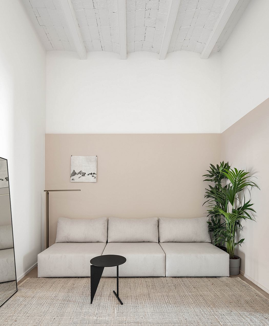 Minimalist corner with white sofa, exposed beams, and green plant.
