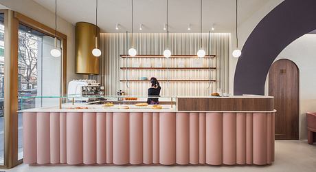 Chic café interior with pleated counter and vertical wood slats