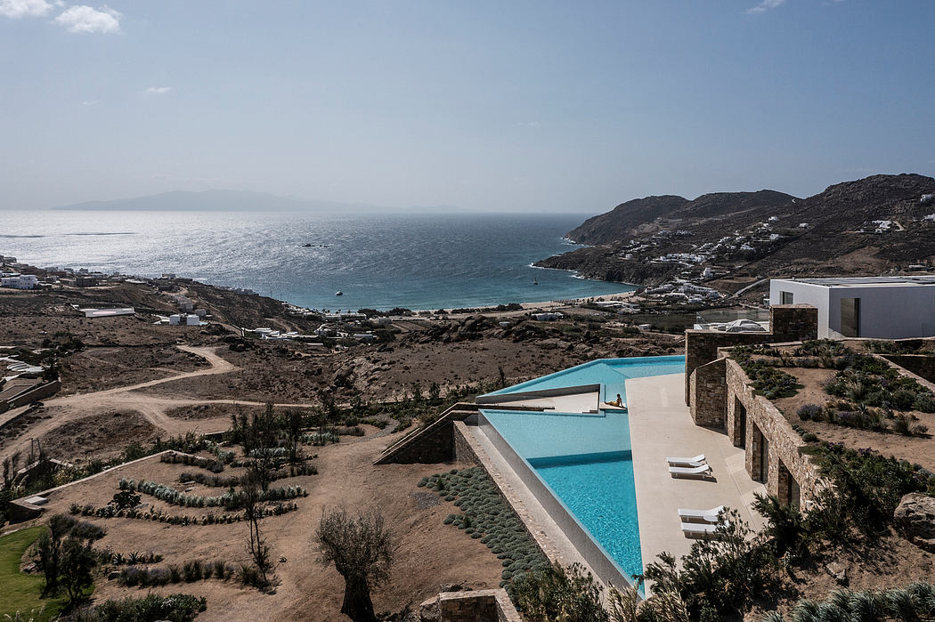 Minimalist villa with pool overlooking the sea.