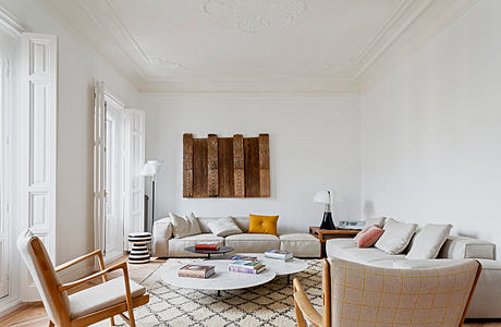 Elegant living room with classic moldings and contemporary furniture.