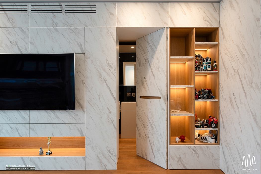 Sleek marble walls, built-in storage shelves, and recessed lighting create a modern, minimalist interior.