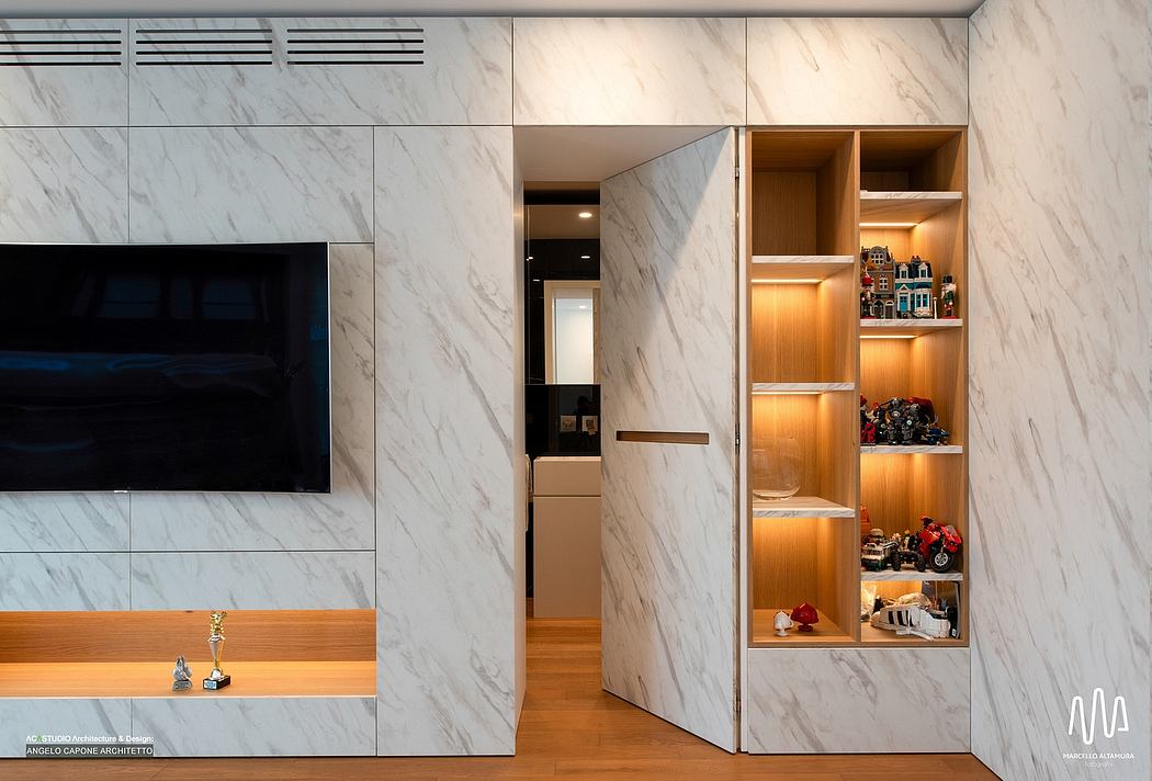 Sleek marble walls, built-in storage shelves, and recessed lighting create a modern, minimalist interior.