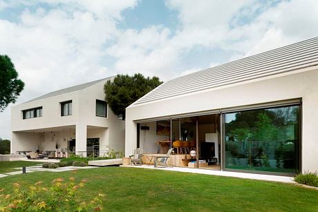 Modern house with large windows and a patio area.