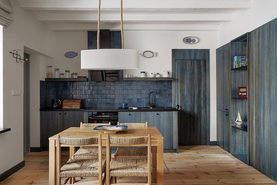 Modern kitchen with wooden table, blue cabinets, and pendant lighting.
