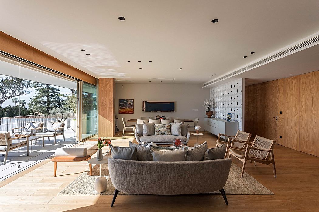 Contemporary living room with wooden finishes and large windows.