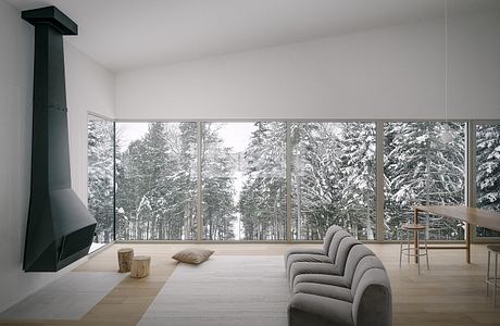 Minimalist living room with large windows overlooking snowy trees.