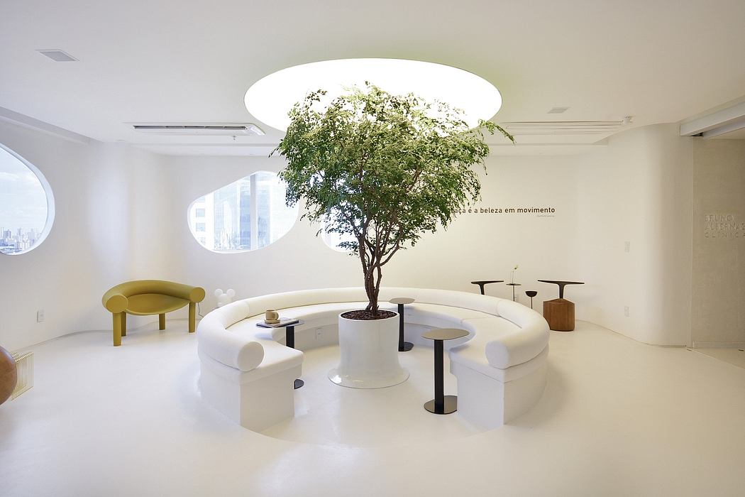 Sleek, minimalist lounge with a verdant tree as the centerpiece, surrounded by curved white seating.