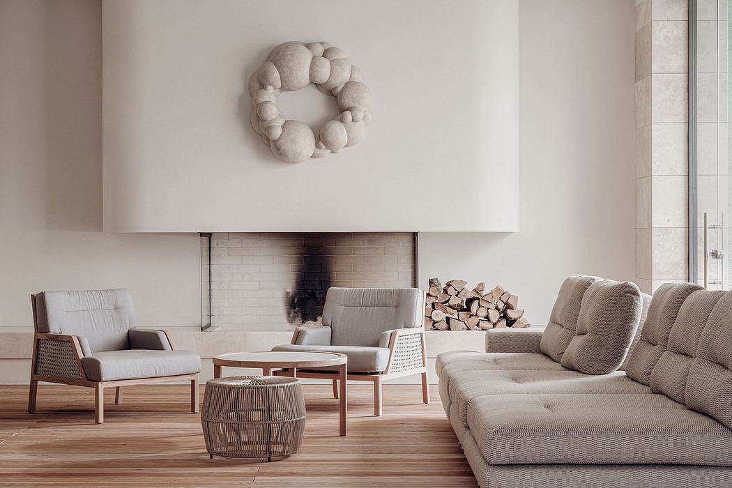 Minimalist living room with fireplace, contemporary furniture, and textured wall decor.