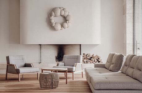 Minimalist living room with fireplace, contemporary furniture, and textured wall decor.