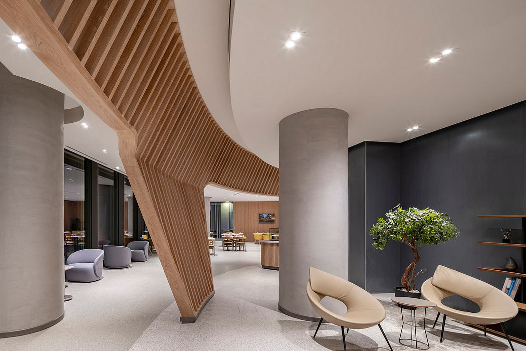 Modern interior with curved wooden staircase, concrete pillars, and elegant furniture.