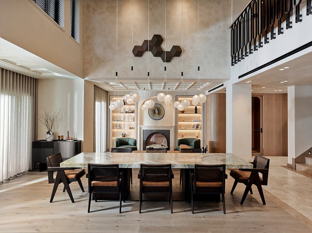 Elegant, modern dining room with geometric light fixtures, marble table, and plush seating.