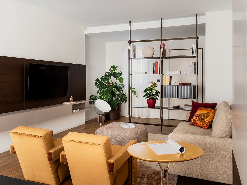 Stylish modern living room with sleek TV unit, shelving, and plush seating.