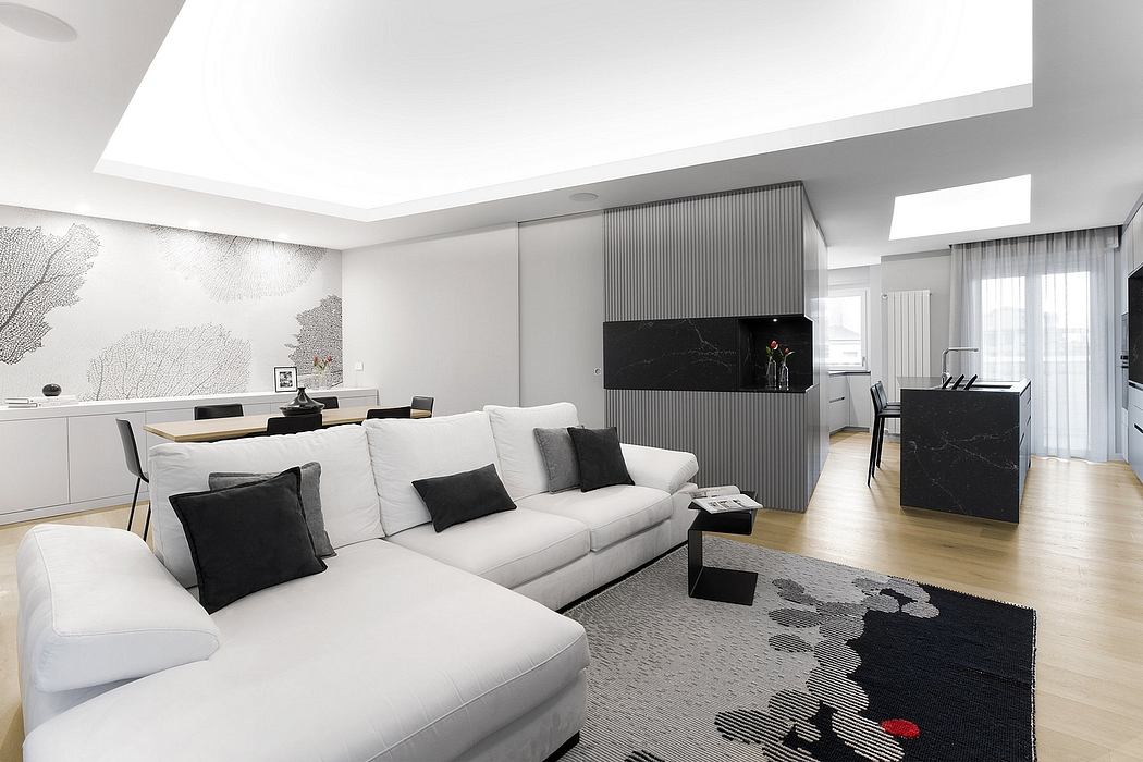 Spacious modern apartment with sleek black and white decor, built-in furniture, and large windows.