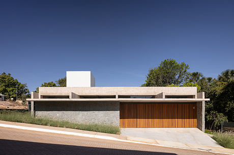 Sleek, modern home with clean lines, natural stone, and wooden accents.