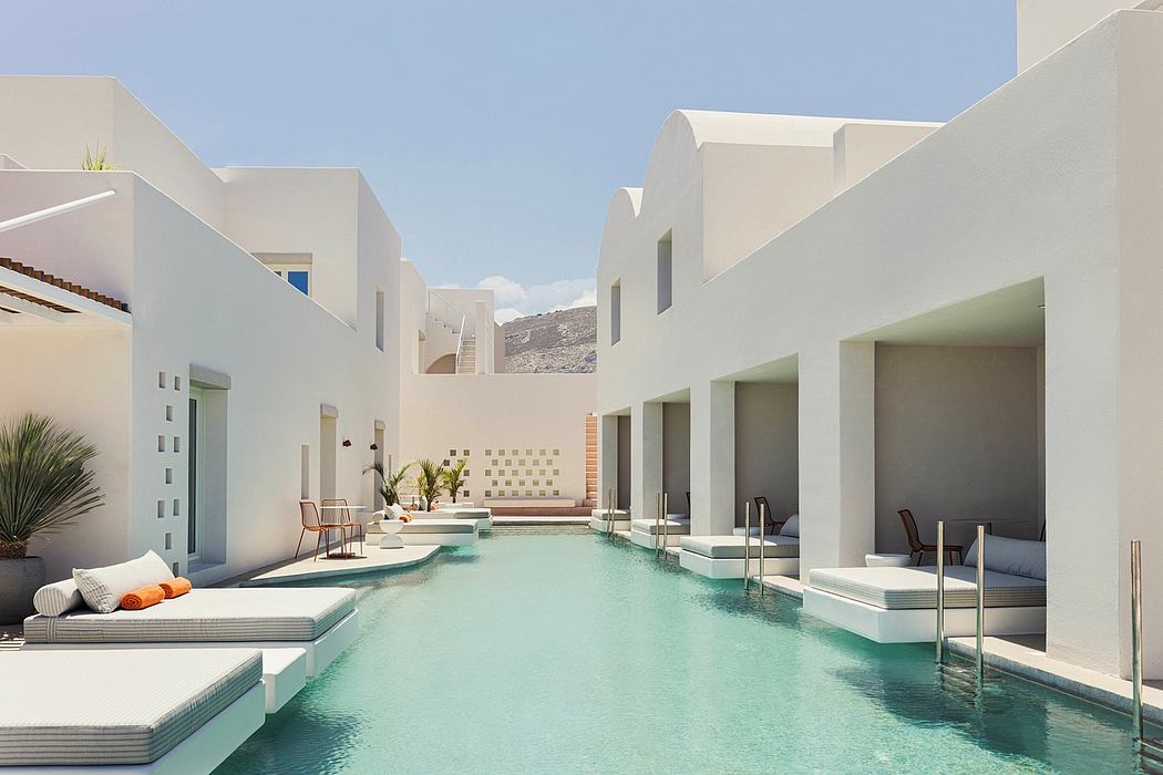 A serene contemporary courtyard with a rectangular pool surrounded by minimalist architecture.