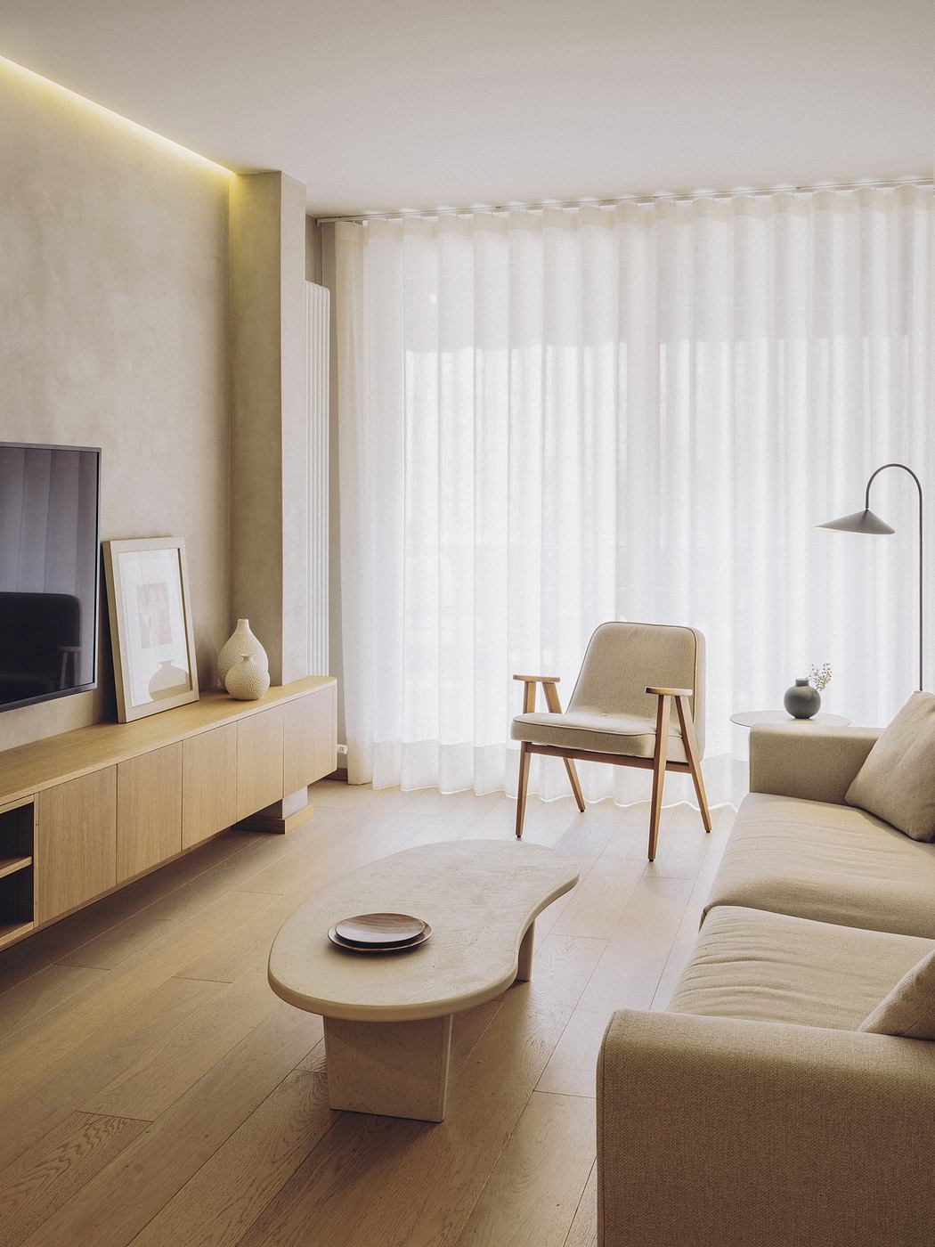 Tranquil living space with clean lines, neutral tones, and natural wood accents.