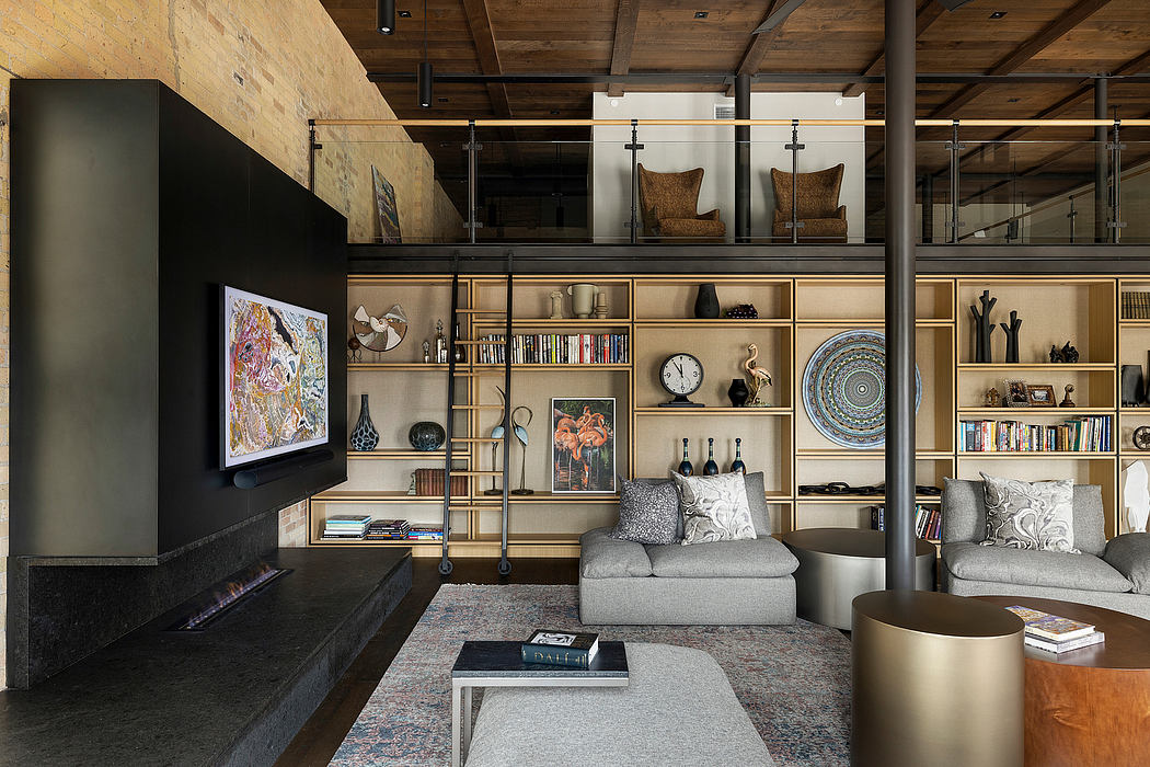 Spacious loft-style interior with wooden beams, built-in shelving, and eclectic decor.