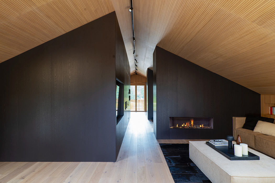 Modern, sleek interior with wood-paneled walls, fireplace, and minimalist furnishings.