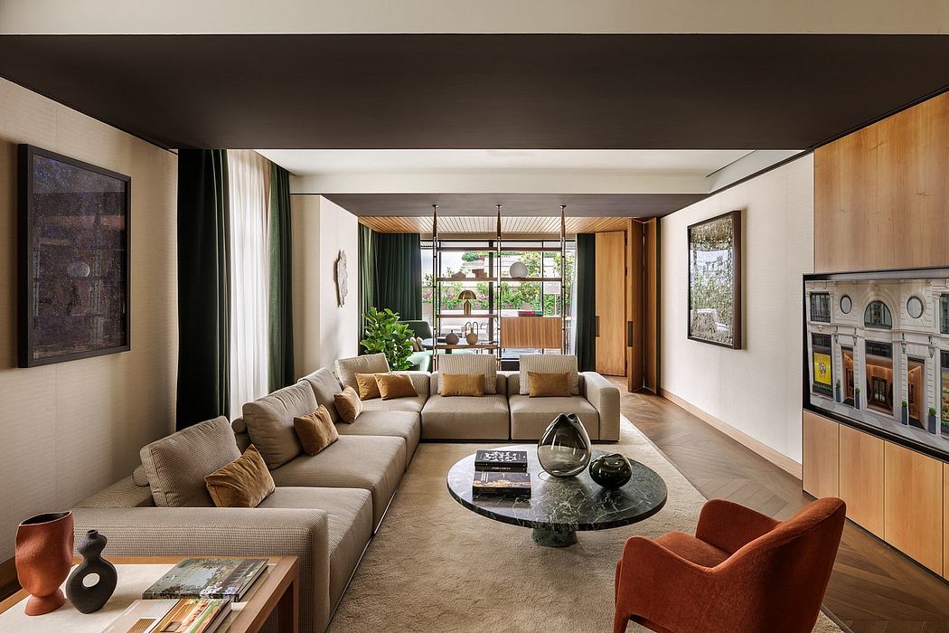 A modern, open-concept living room with wooden accents, plush seating, and a sleek glass coffee table.