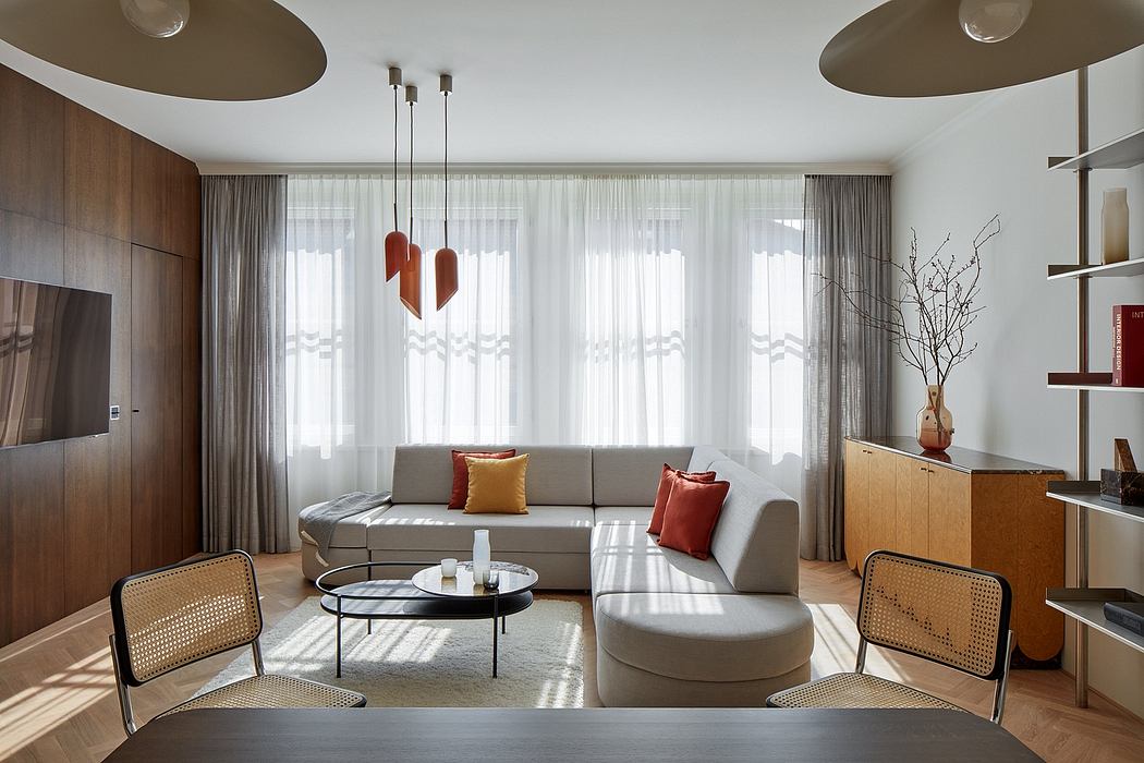 Elegant modern living room with neutral tones, pendant lights, and minimalist furniture.