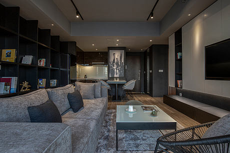 Sleek, modern interior with minimalist furniture, dark accents, and contemporary lighting.