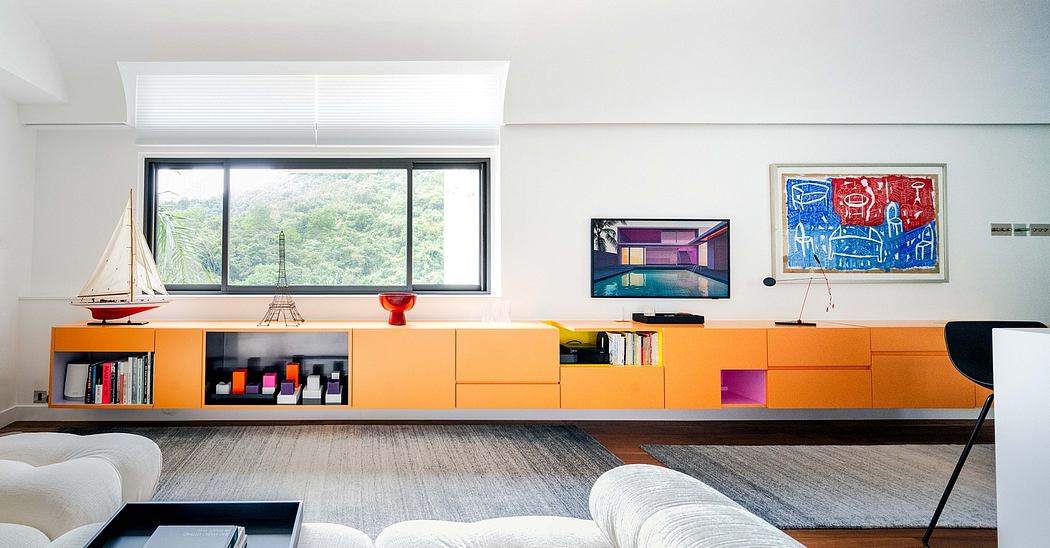 Vibrant modern living space with colorful built-in storage and artwork accents.