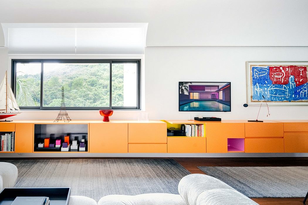 Vibrant modern living space with colorful built-in storage and artwork accents.