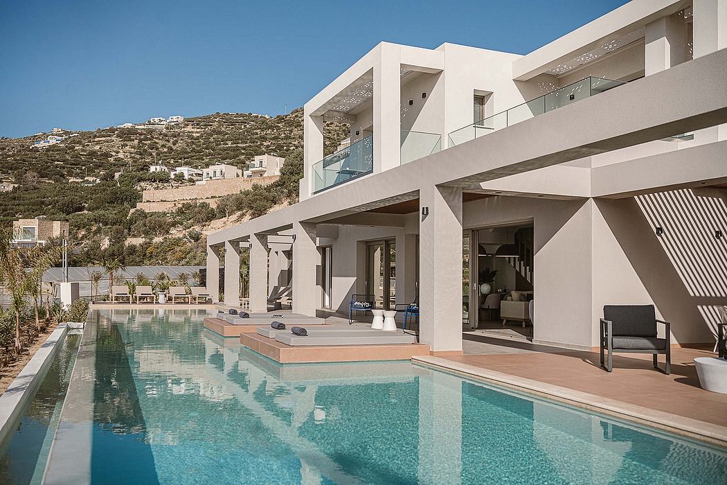 Stunning modern architectural design with a beautiful pool, terraces, and scenic views.
