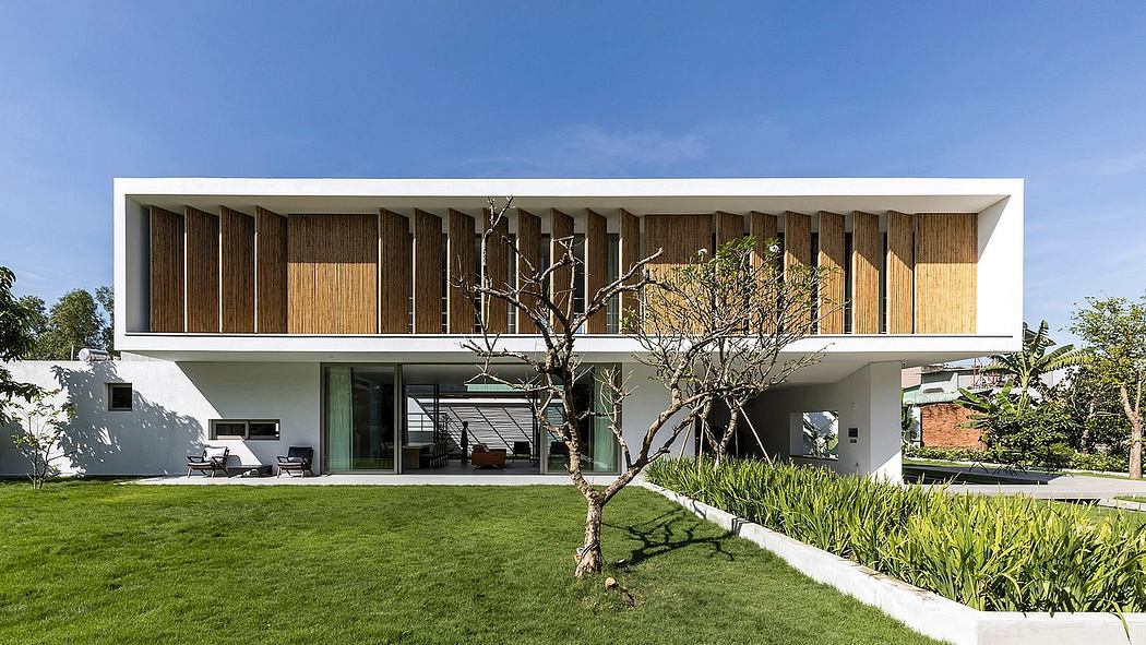 Minimalist architectural design with wooden facade, large glass windows, and lush landscaping.