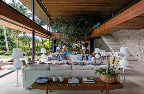 Inviting indoor-outdoor living space with modern wooden and stone architecture.