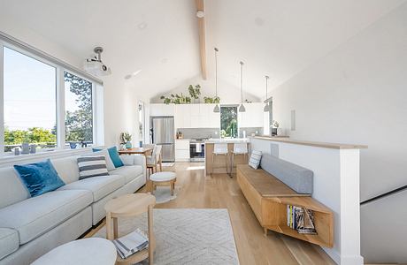 Bright, open-concept living space with clean, modern furnishings and natural wood accents.