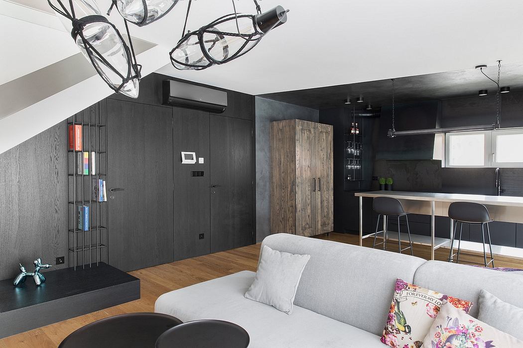 Sleek modern interior with minimalist decor, dark color scheme, and recessed lighting.