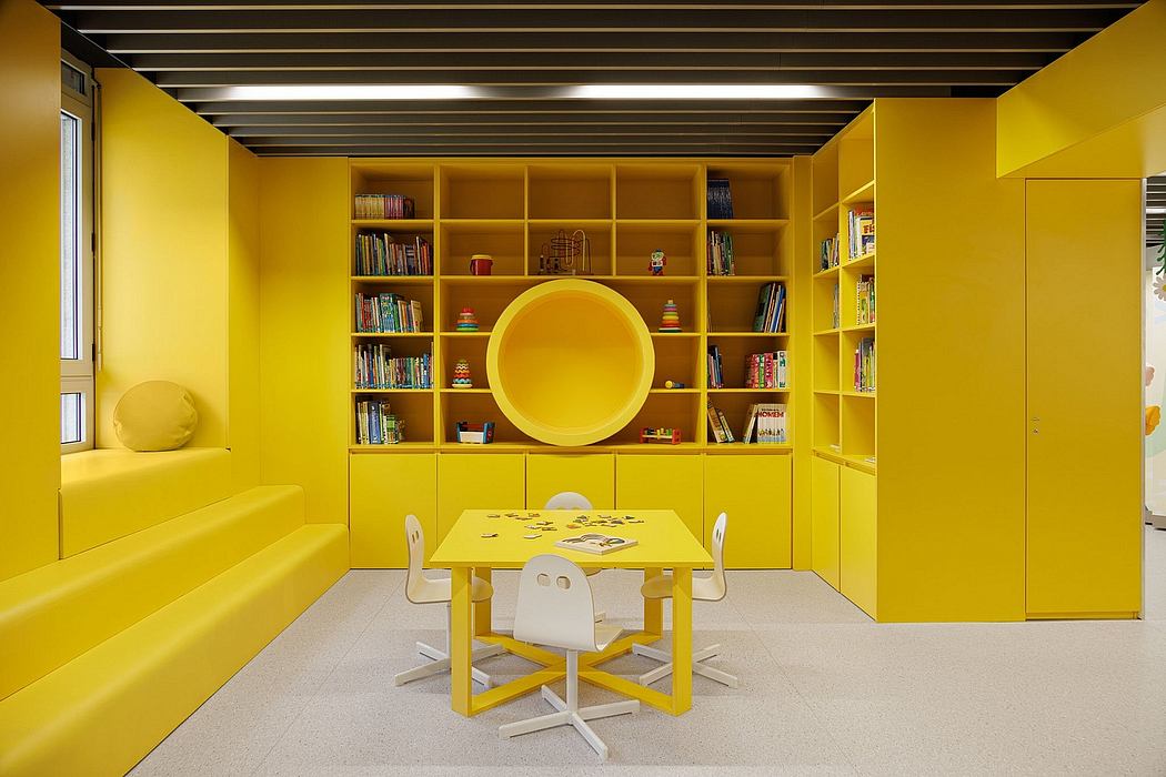 Vibrant yellow-toned interior with built-in shelving, circular window, and minimalist furniture.
