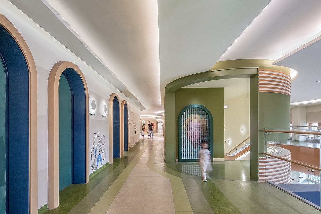 A modern, colorful hallway with arched doorways and geometric design elements.